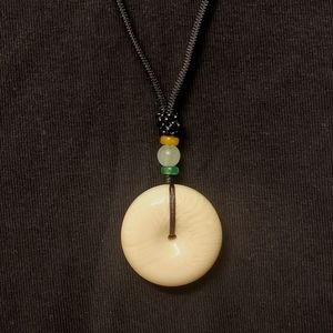 Ivory fruit pendant necklace.